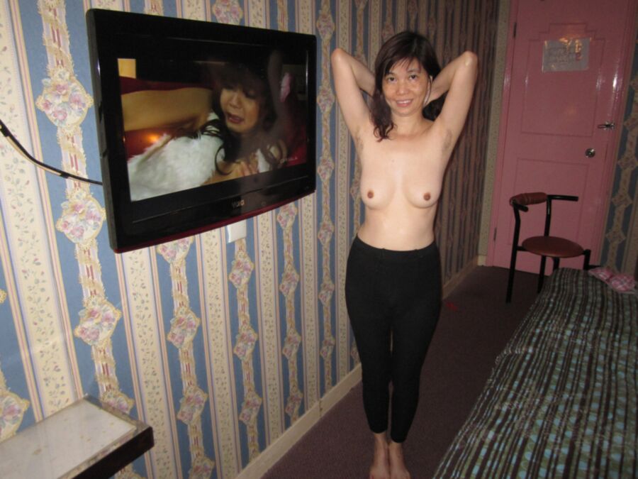 Ann L., HK Chinese, poses for pay in hotels