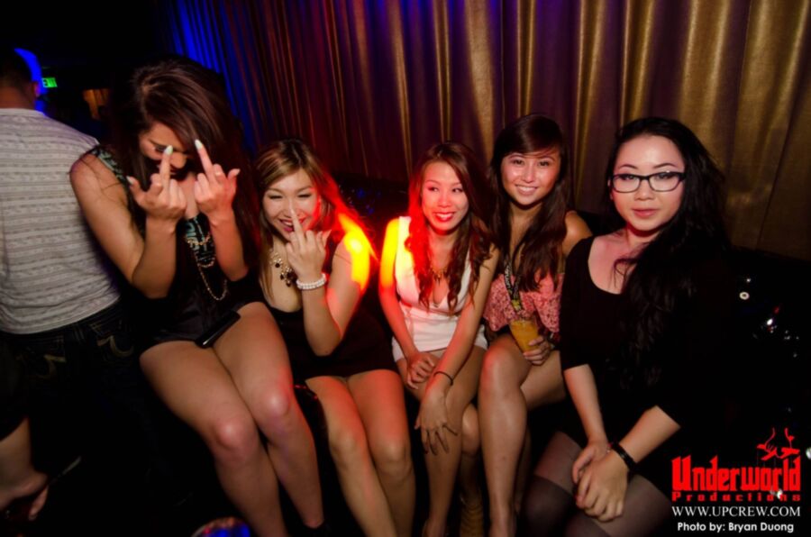 Asian clubbing upskirt. Almost nip slip.