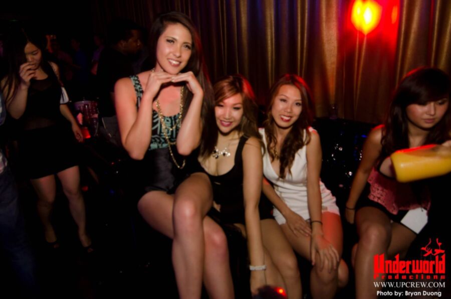 Asian clubbing upskirt. Almost nip slip.