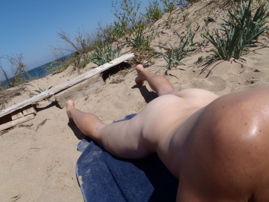 Naked on public beach