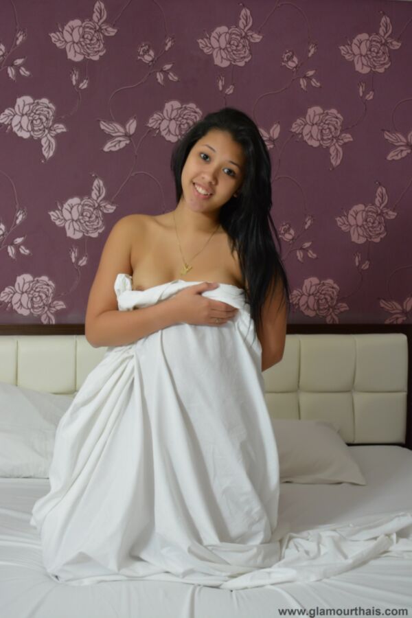 young thai beauty and a very lucky sheet