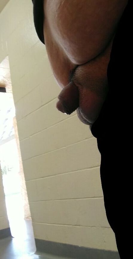 Cock out in a public restroom.