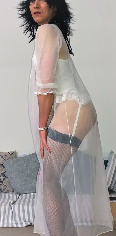 Asian sissy Olivia trying on a white nightie for the night