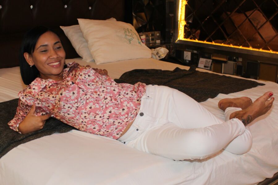 Pretty Latina Girl in a Pink Top and White Jeans