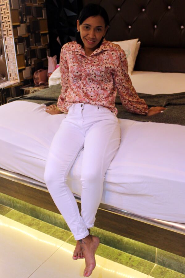 Pretty Latina Girl in a Pink Top and White Jeans