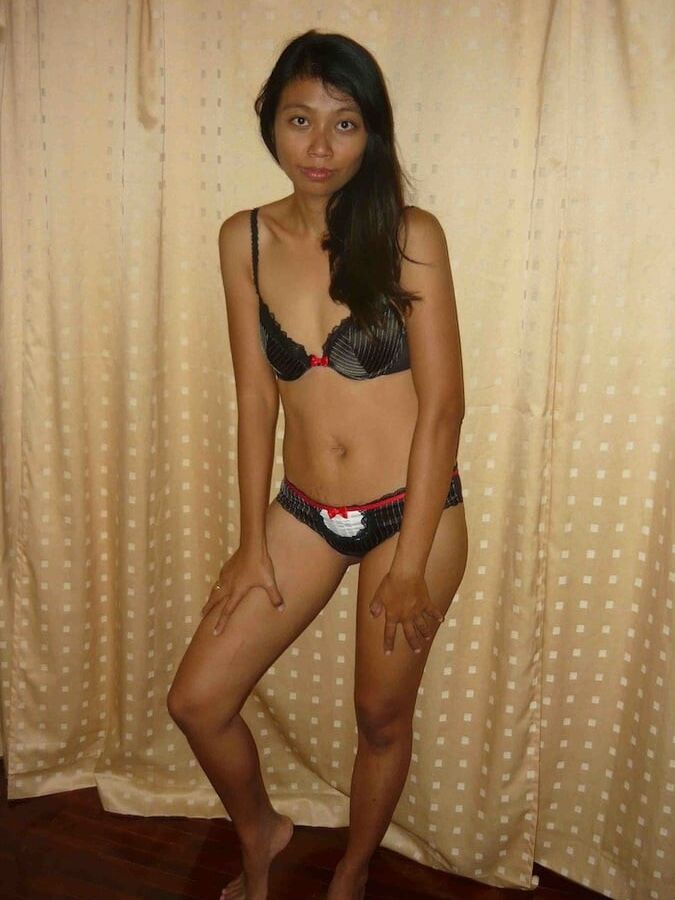 thai girl posing in motel room