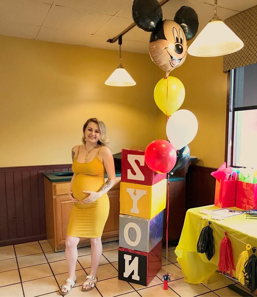 Young Pregnant Woman in Yellow