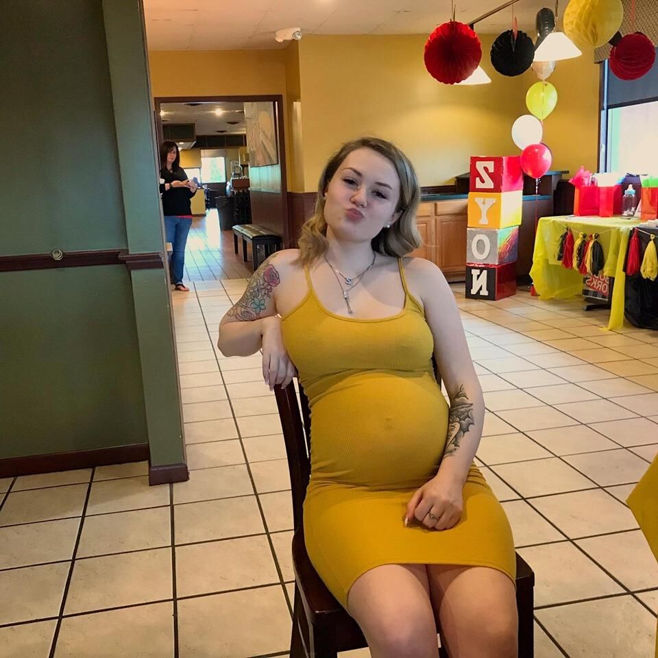 Young Pregnant Woman in Yellow