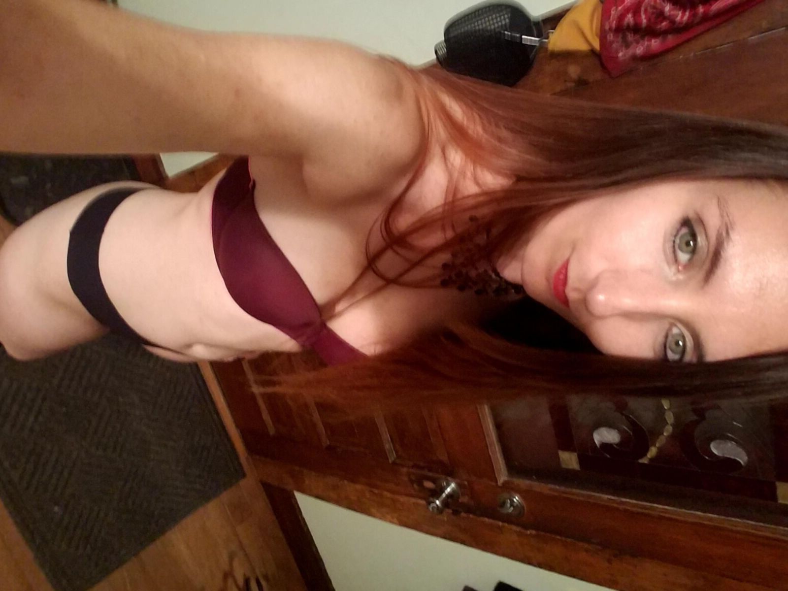 Redhead me stripping out of black formal dress