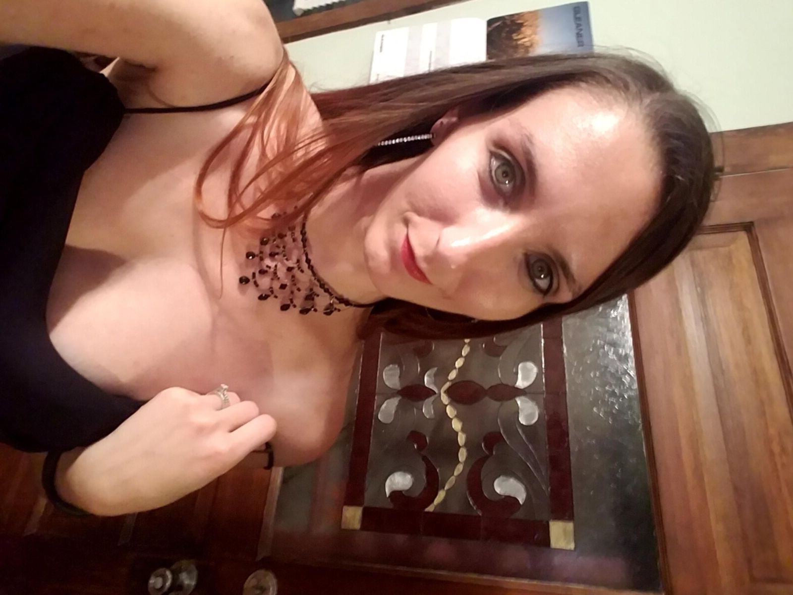 Redhead me stripping out of black formal dress