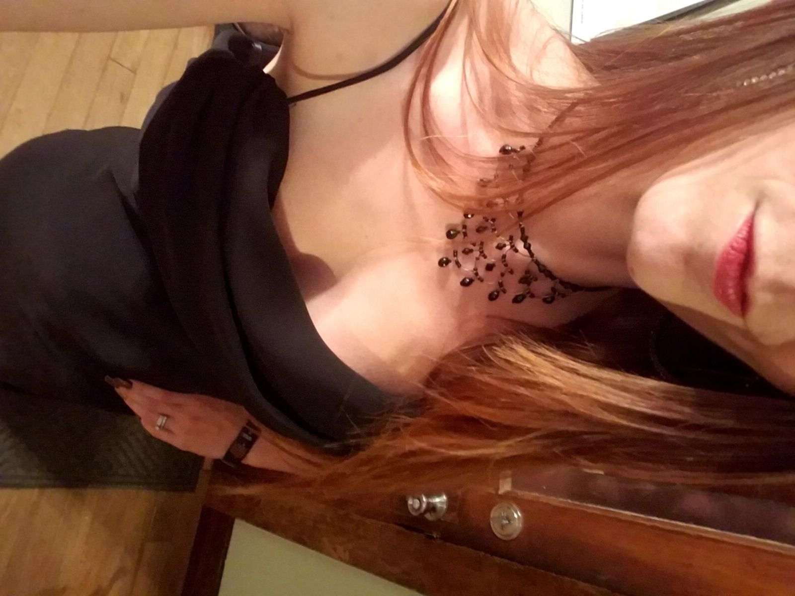 Redhead me stripping out of black formal dress