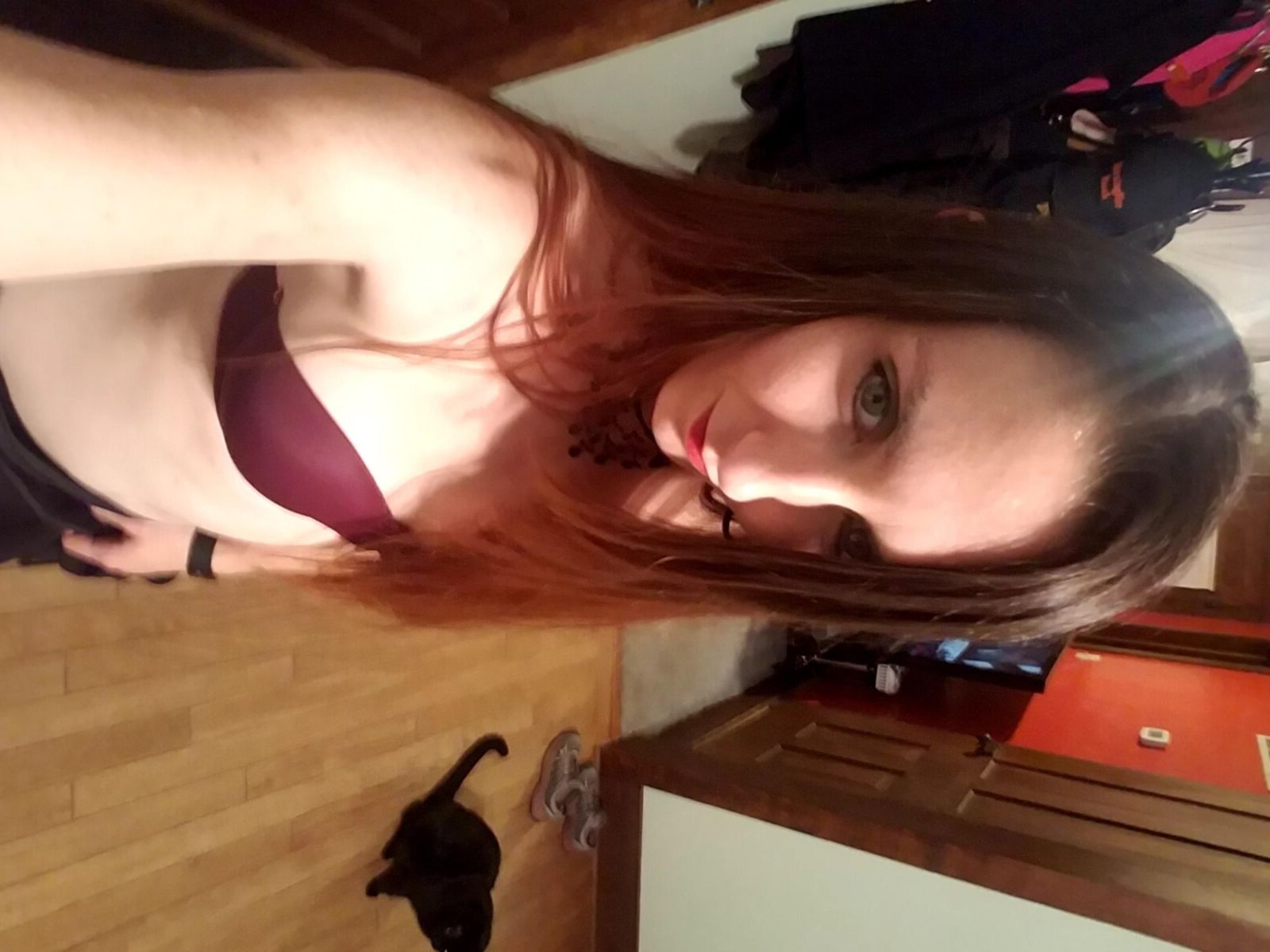 Redhead me stripping out of black formal dress