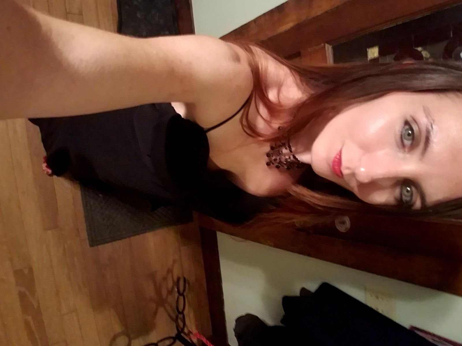 Redhead me stripping out of black formal dress