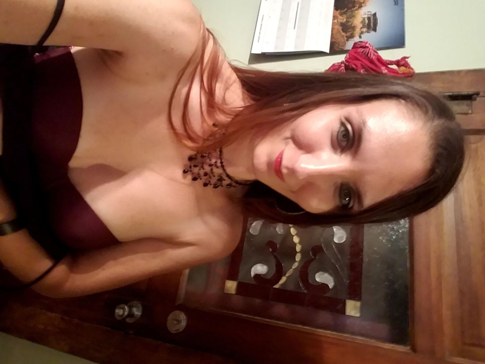 Redhead me stripping out of black formal dress