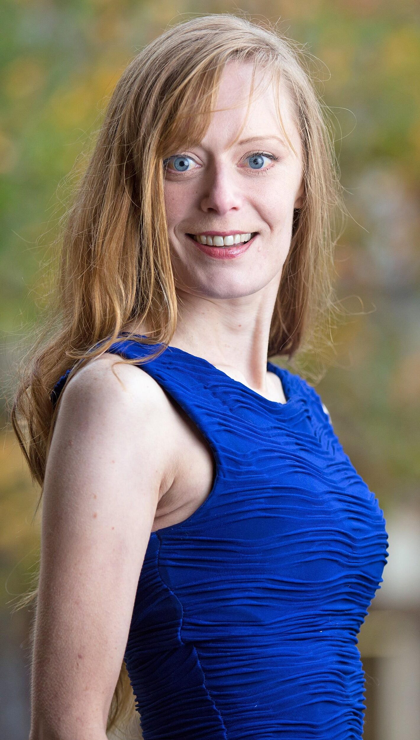 Hot redhead in a blue dress