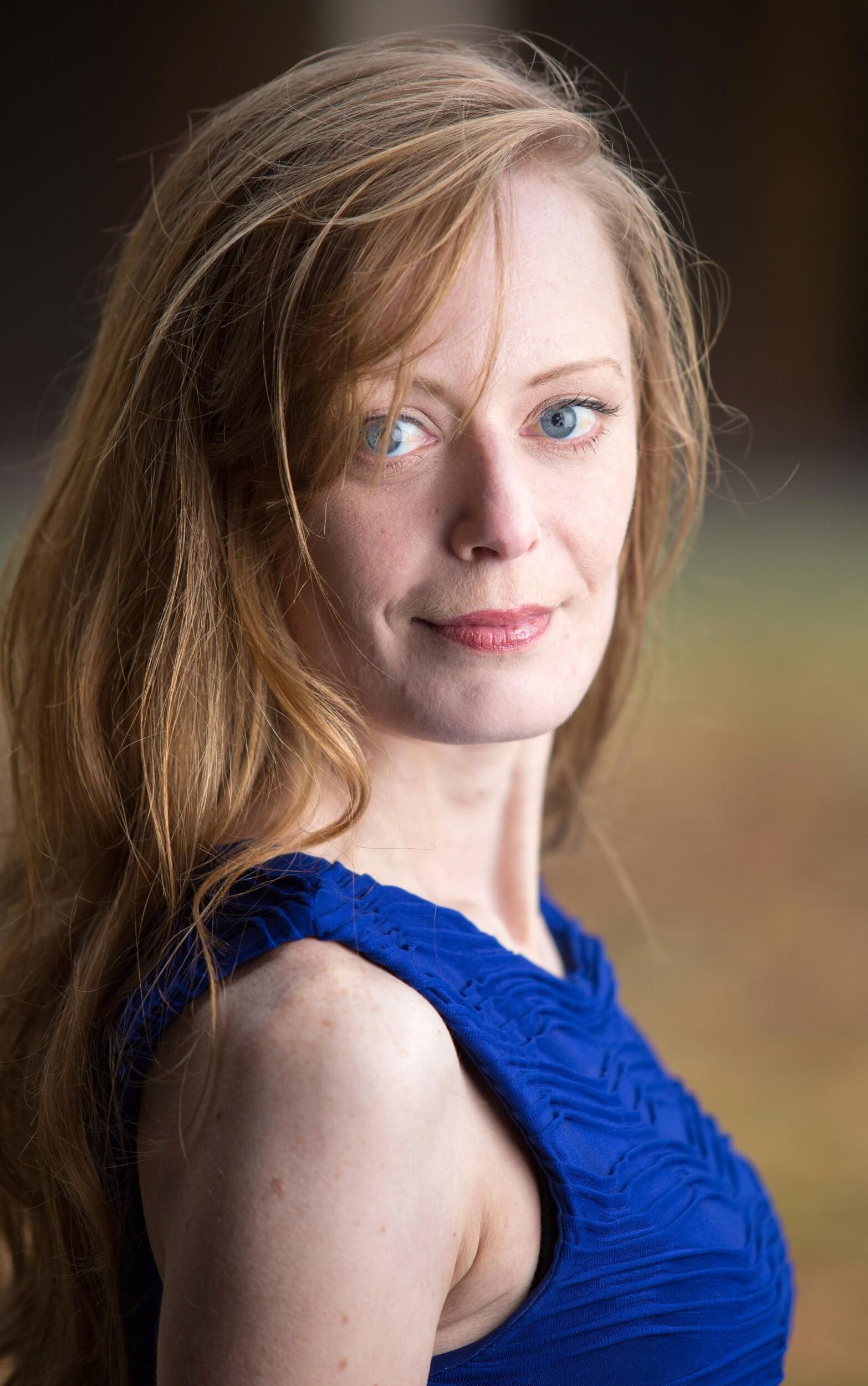 Hot redhead in a blue dress