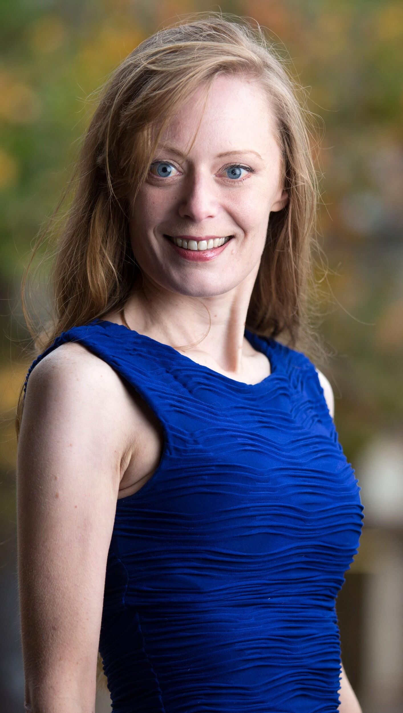 Hot redhead in a blue dress