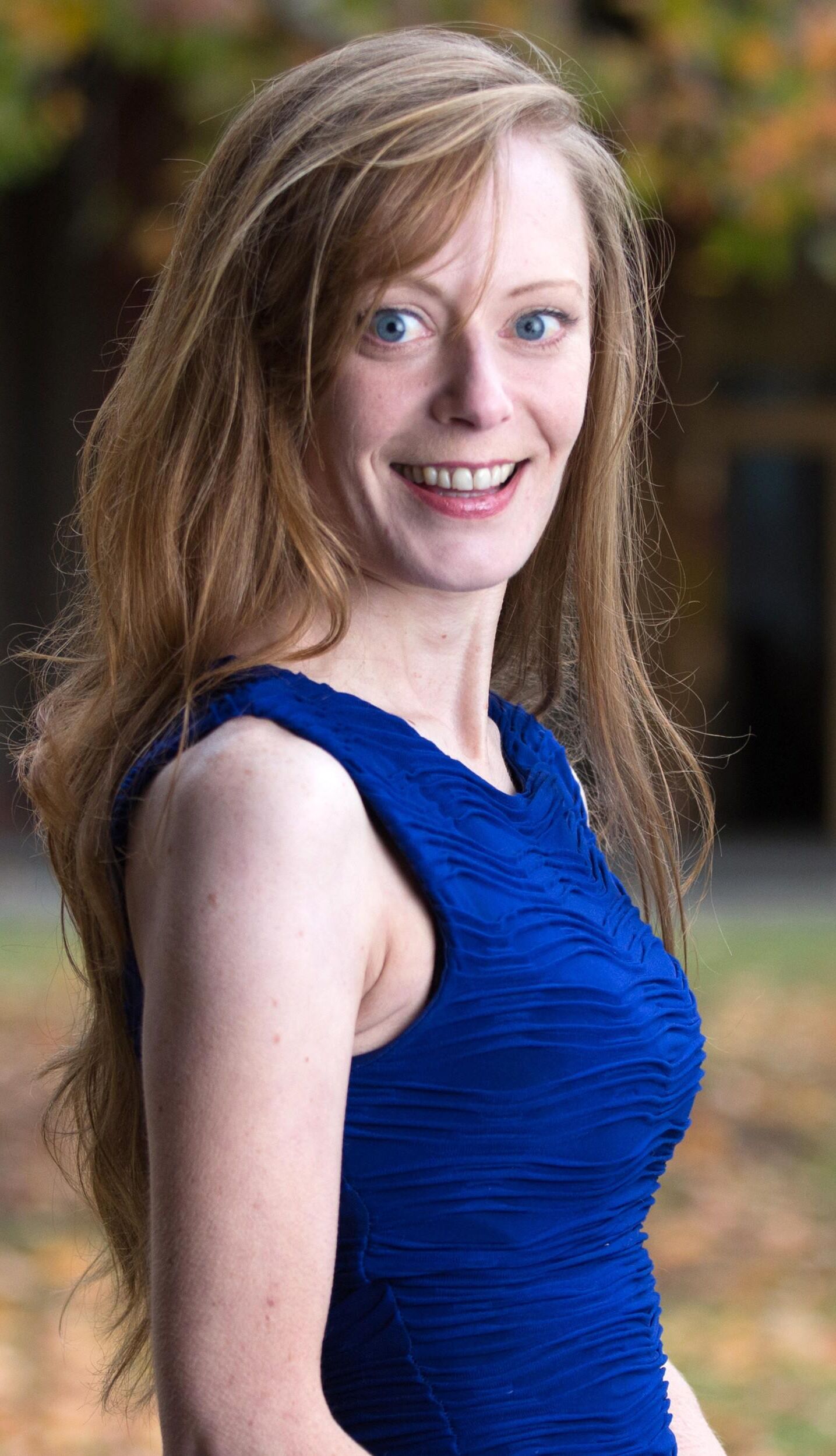 Hot redhead in a blue dress