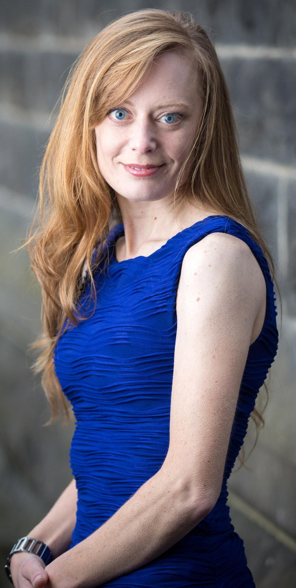 Hot redhead in a blue dress