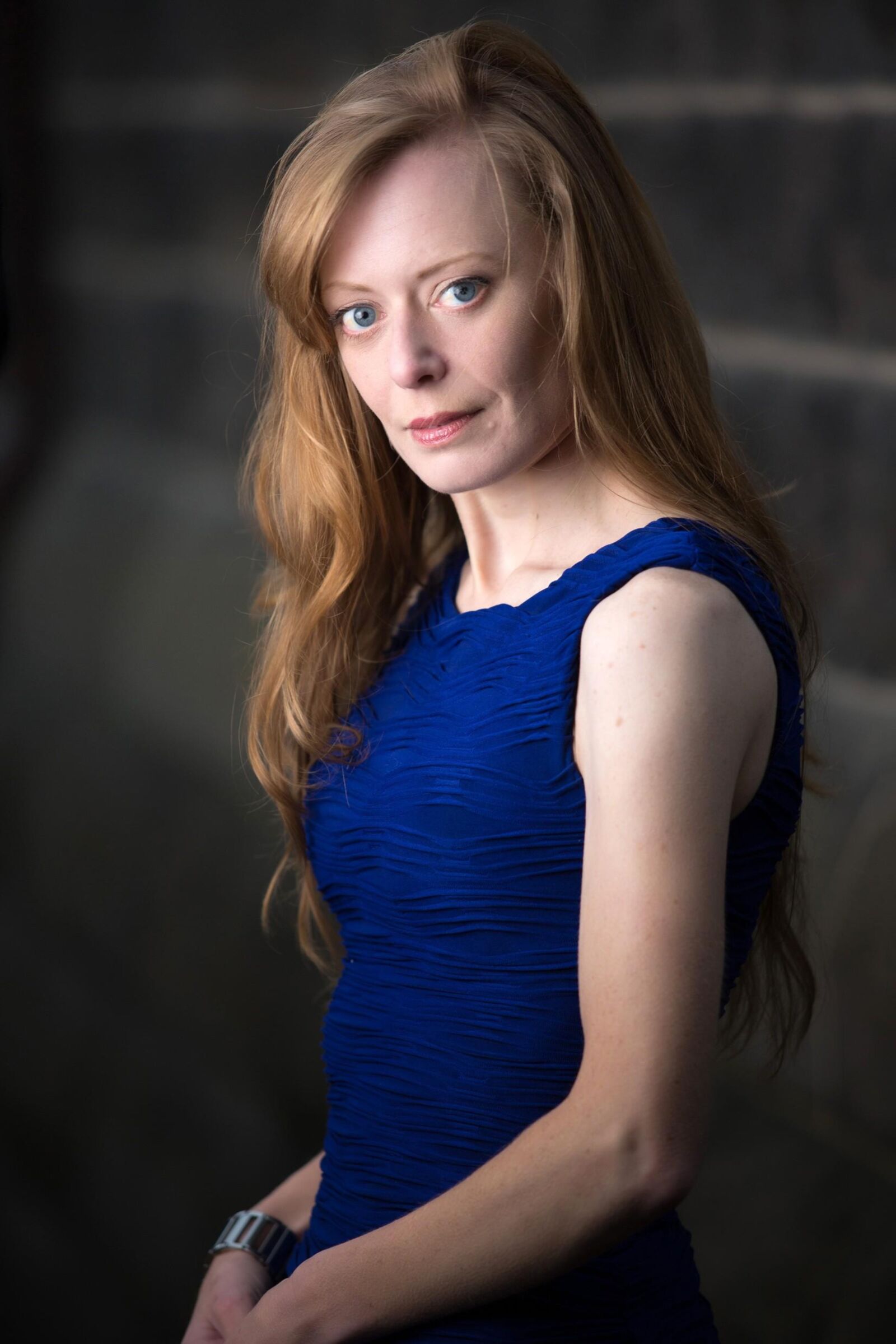 Hot redhead in a blue dress