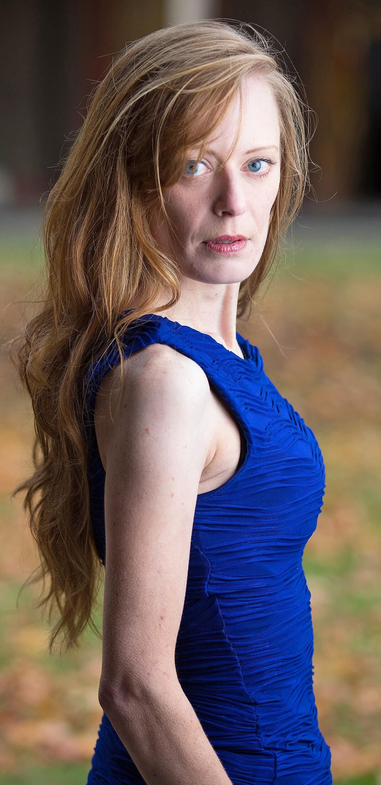 Hot redhead in a blue dress