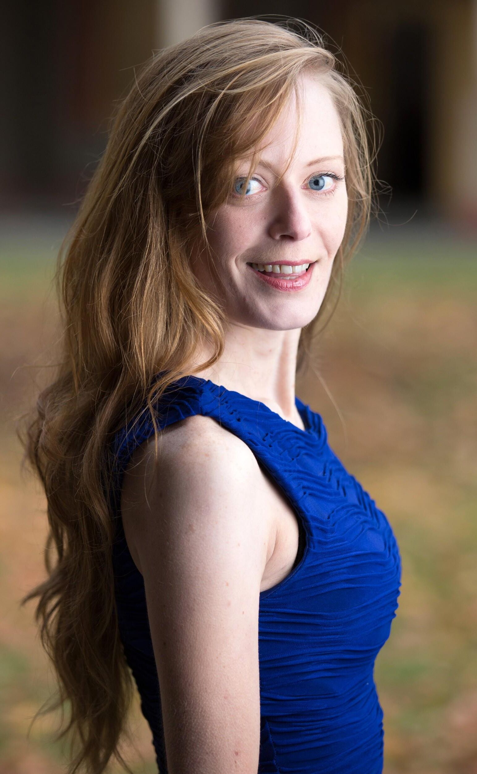 Hot redhead in a blue dress