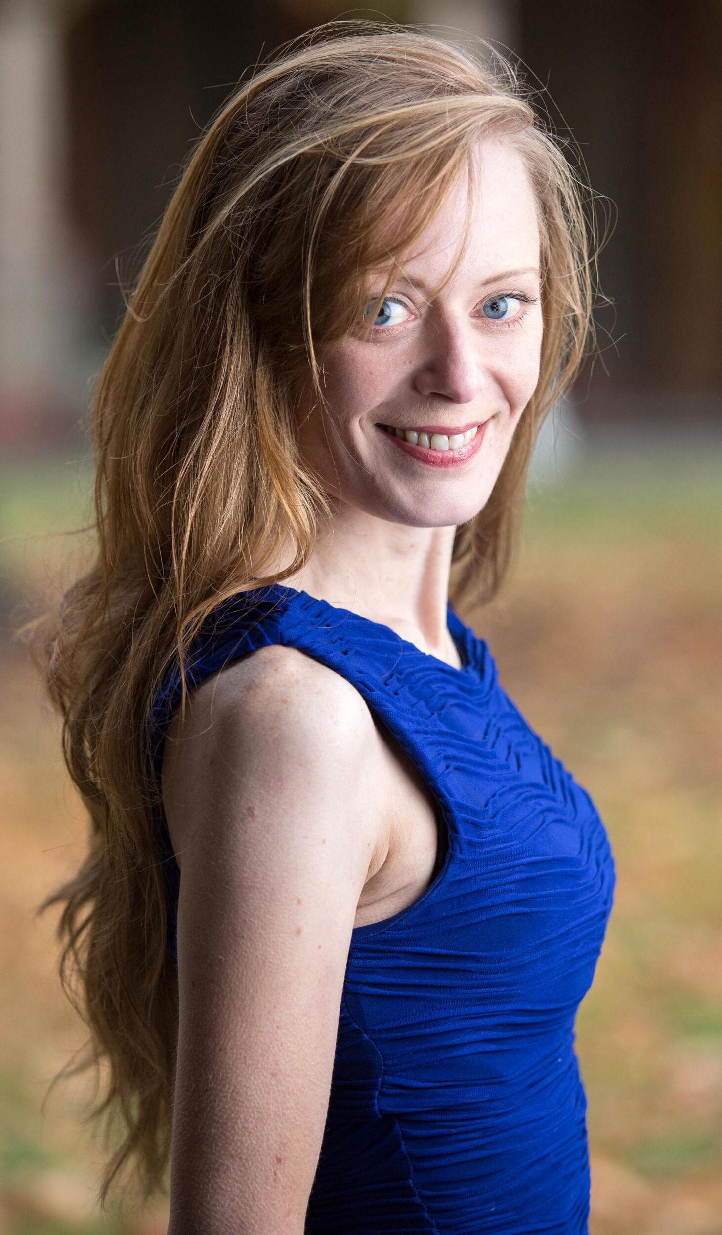 Hot redhead in a blue dress