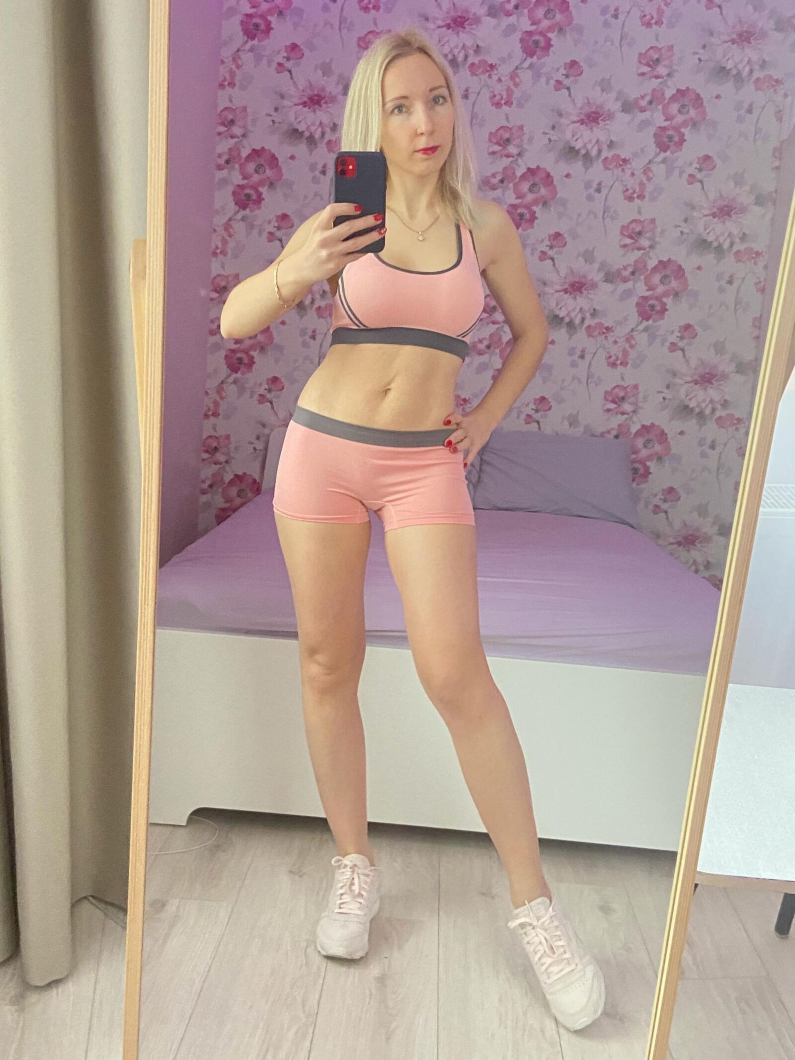 Russian blonde MILF in sporty outfit making selfies. Repost.