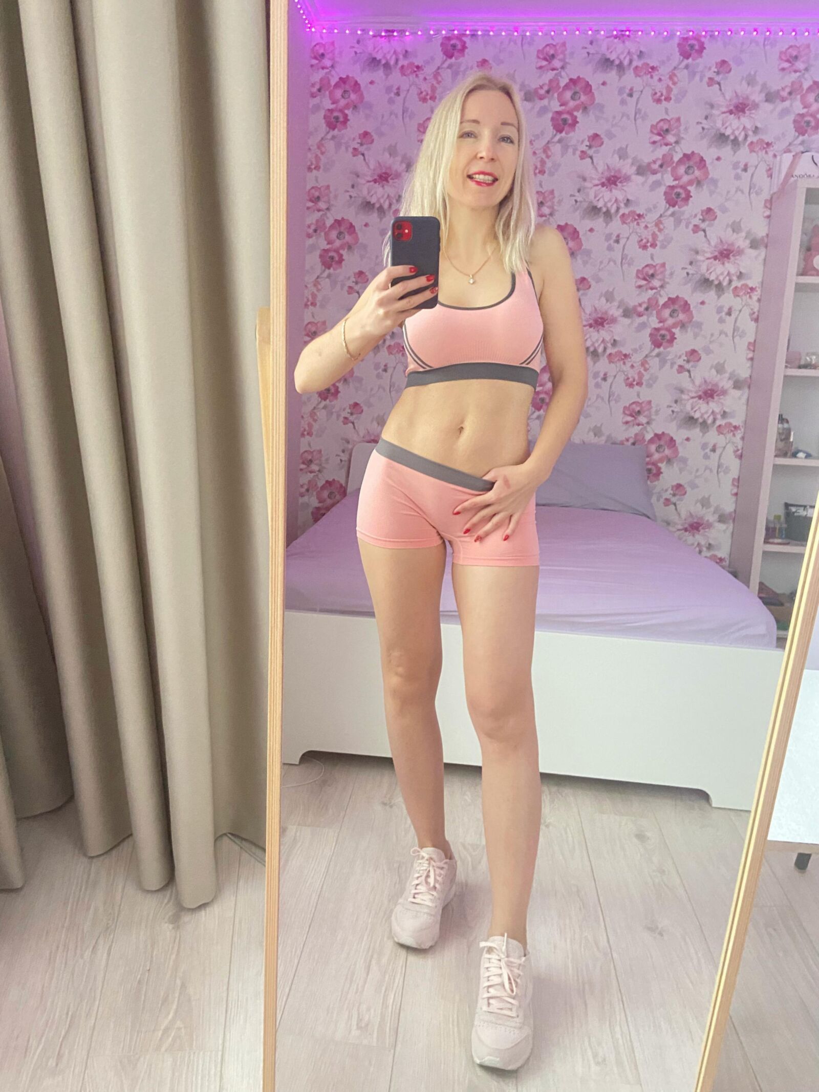 Russian blonde MILF in sporty outfit making selfies. Repost.