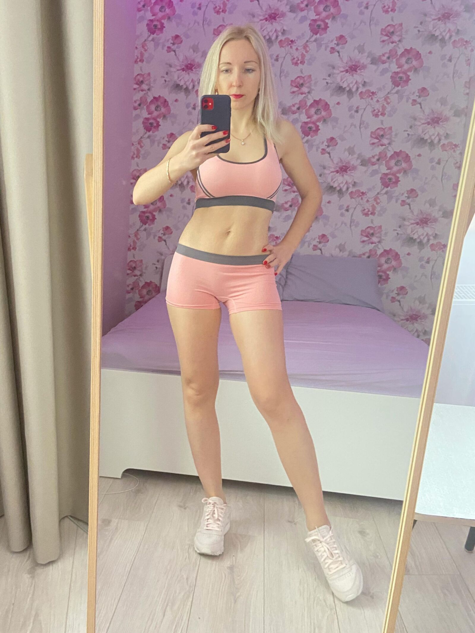 Russian blonde MILF in sporty outfit making selfies. Repost.