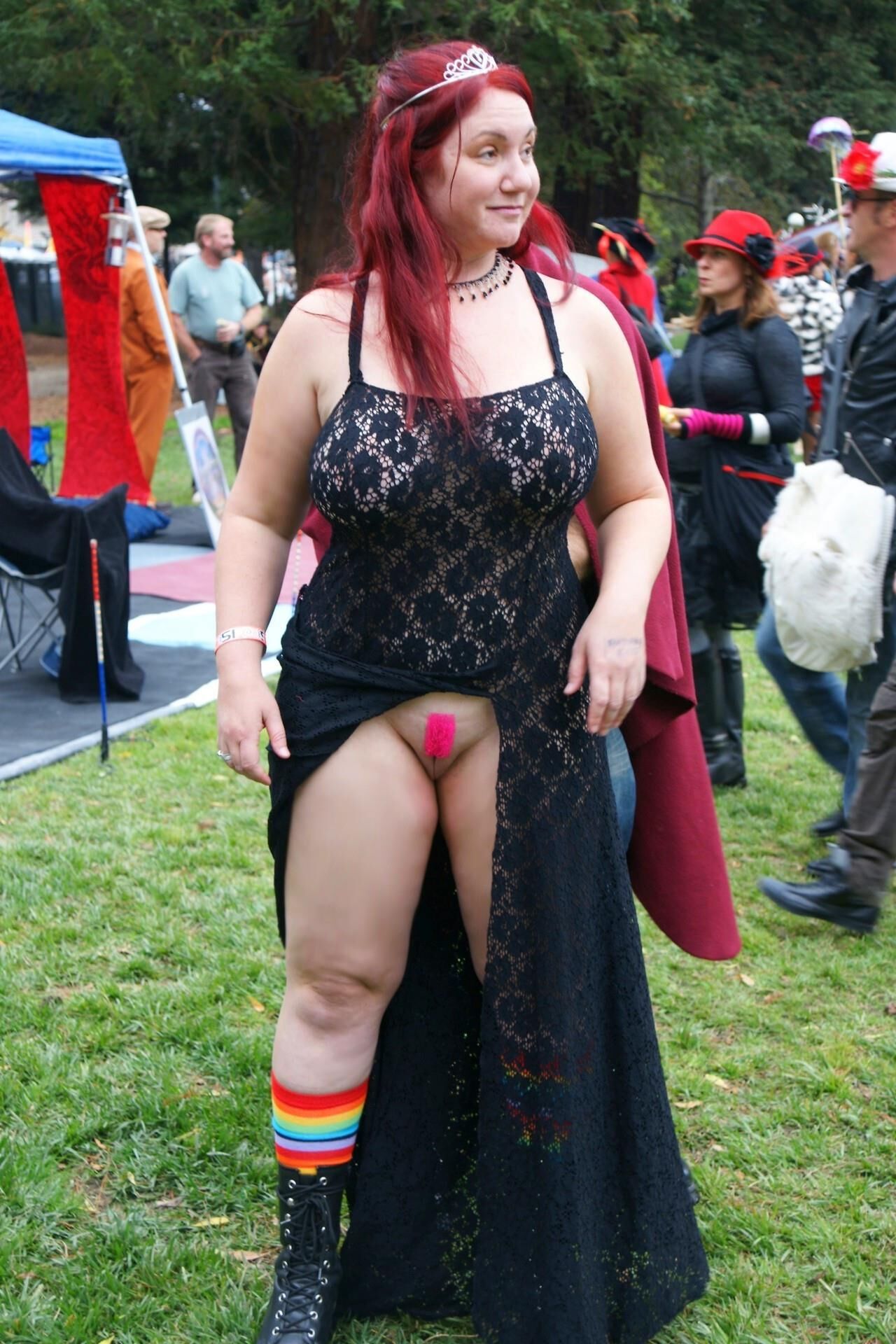Bottomless red head queen flashing at event / festival 