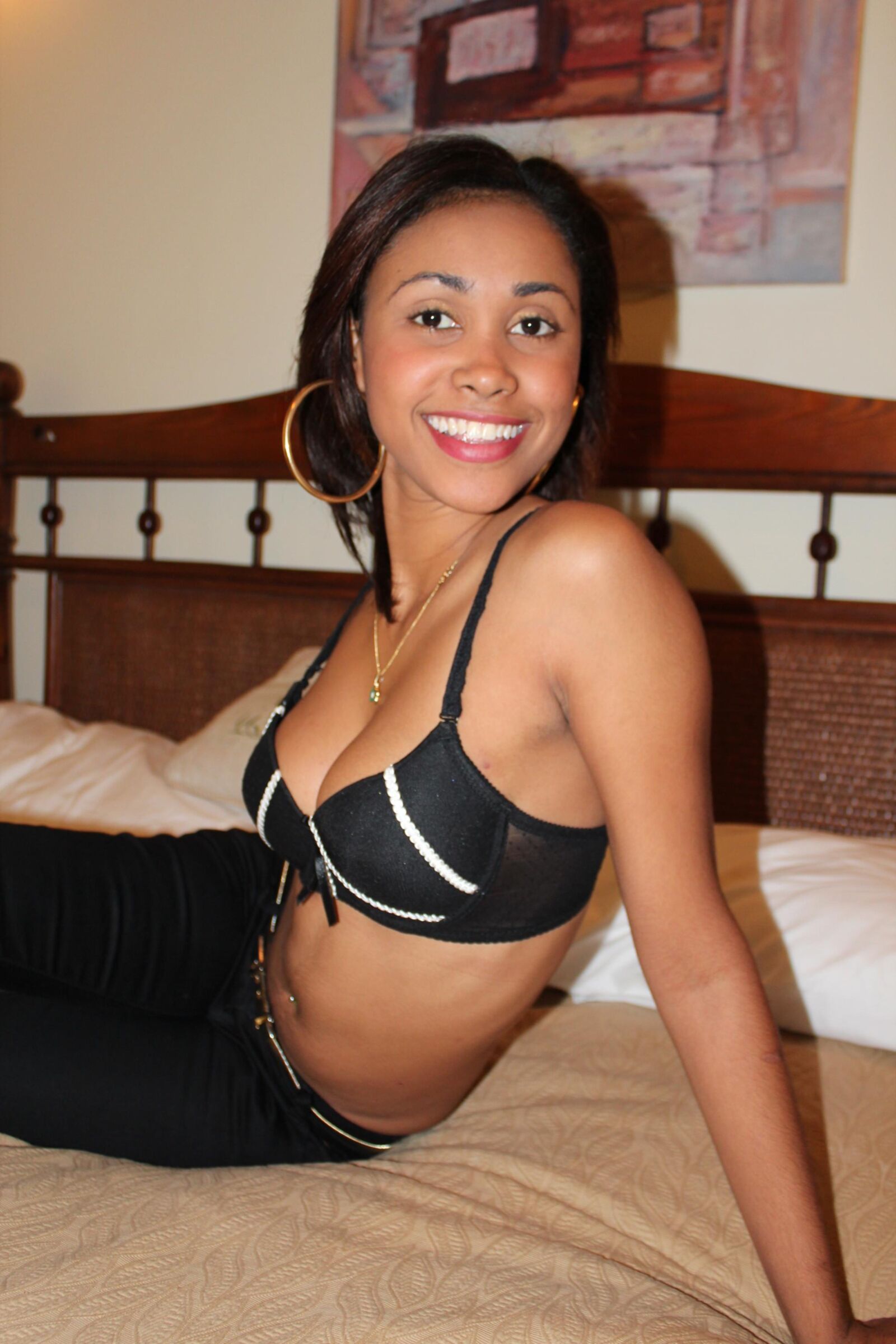 Sexy Slender Latina Removes Her Top and Gets Comfortable