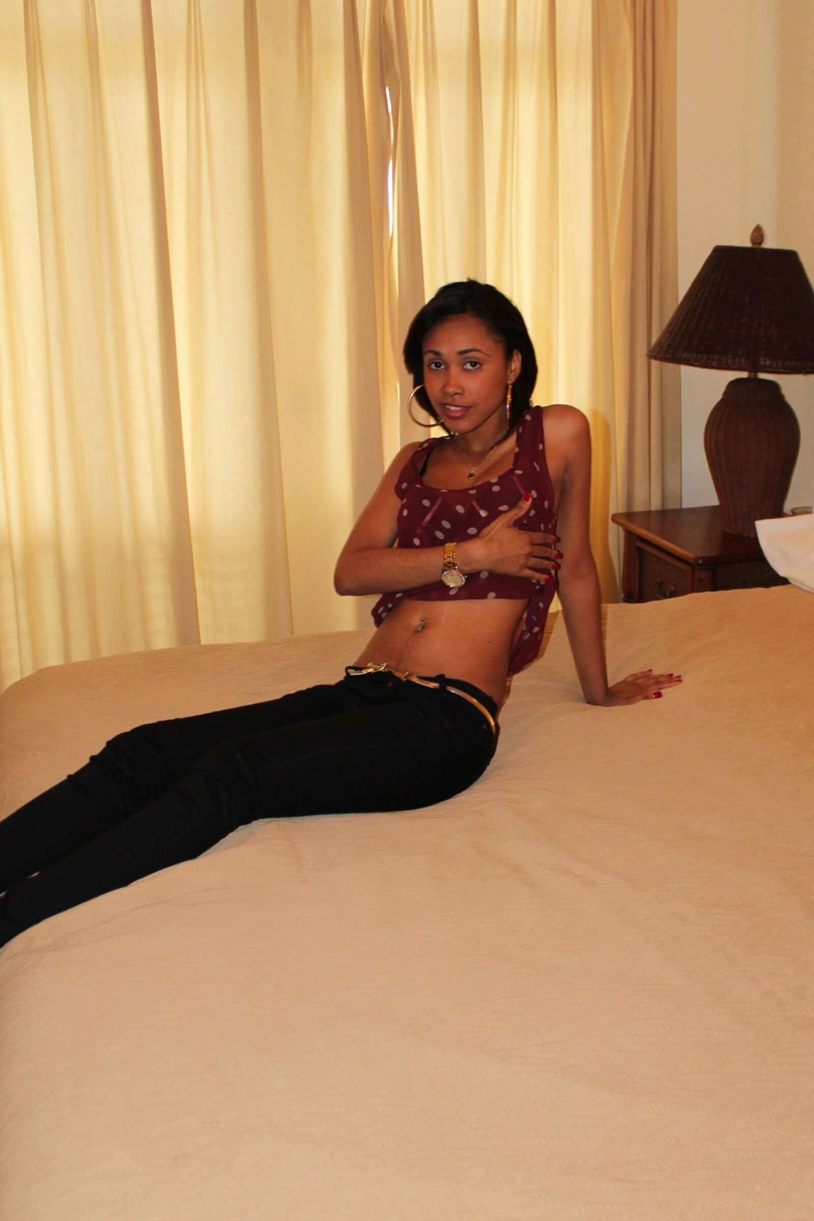 Sexy Slender Latina Removes Her Top and Gets Comfortable